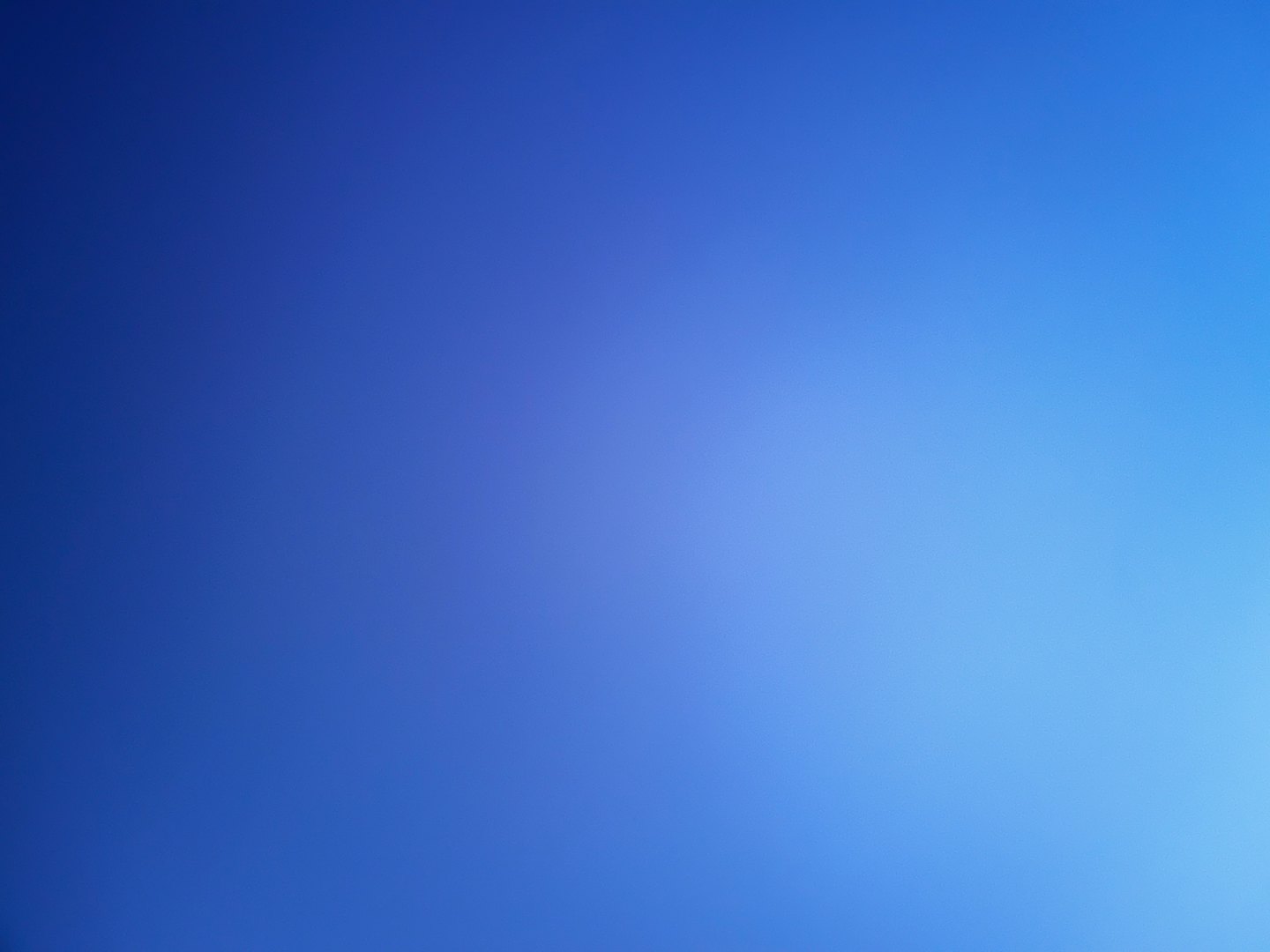 Smooth gradient transitioning from dark blue to light blue.